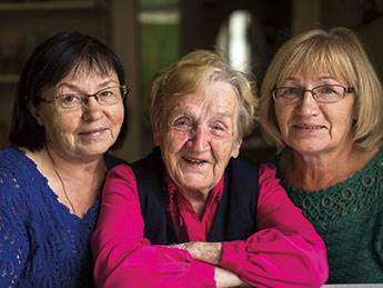 Photo of three women smiling